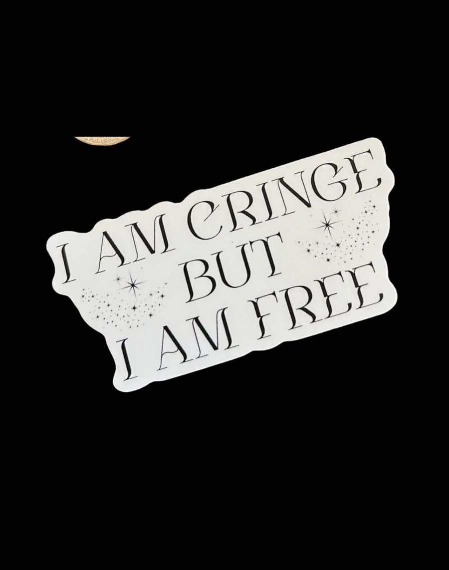 White die-cut sticker reading 'I am cringe but I am free' in gothic lettering